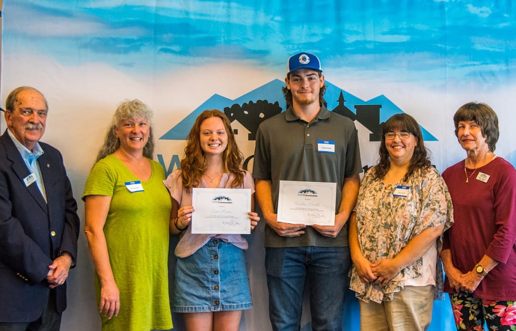 Recipeints Erin Huter and Tucker Smith a presented with certificates of awards.